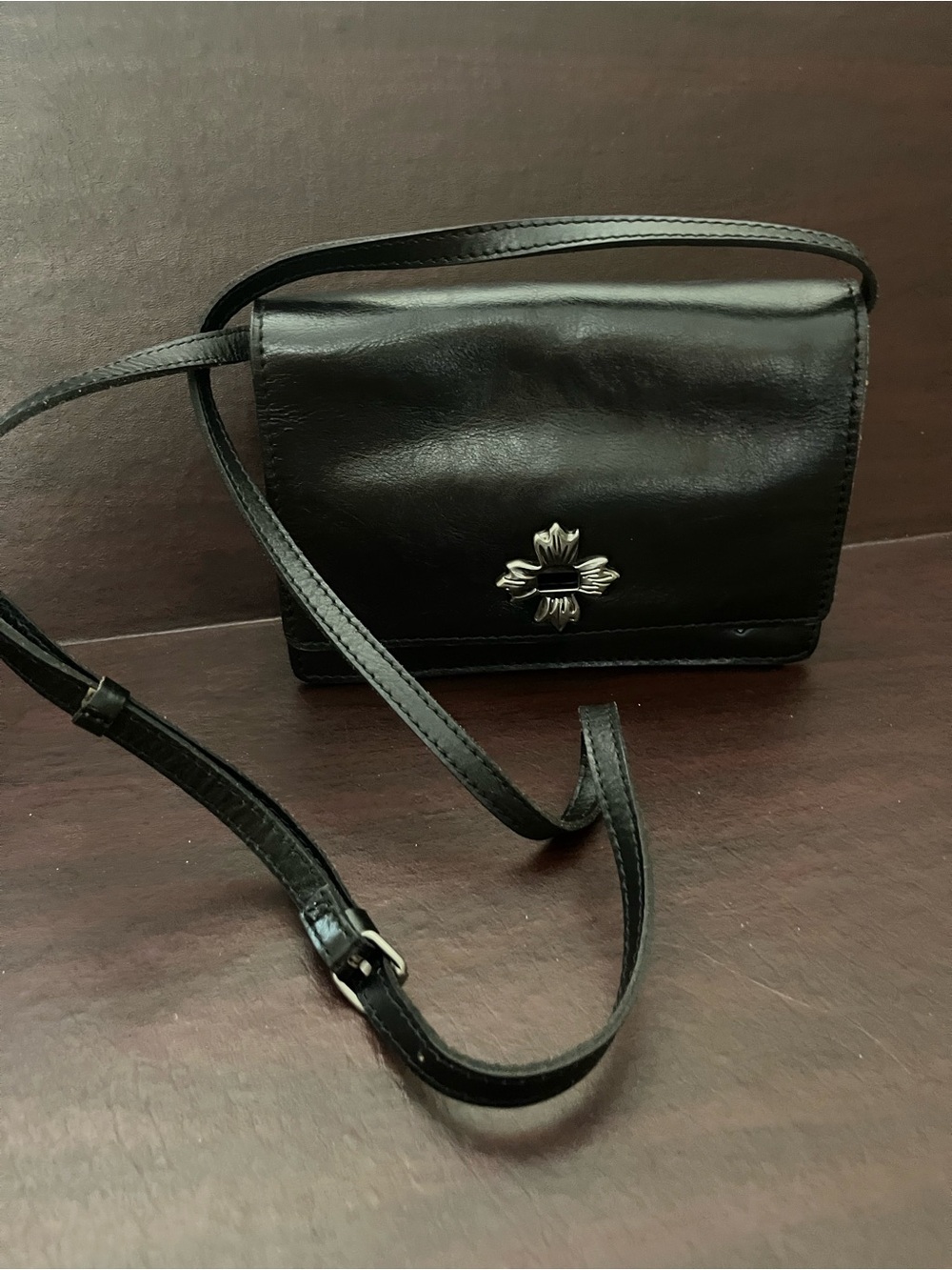 Patricia Nash Classic Black Leather Crossbody with Silver Floral Emblem